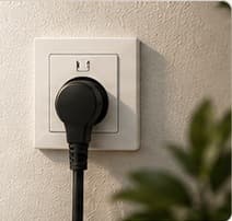 A charging plug in a standard household wall socket